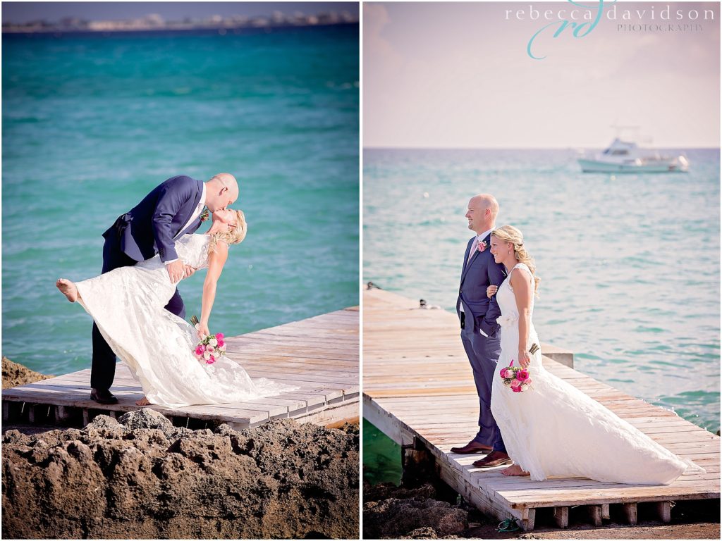 kissing on dock with navy blue suit