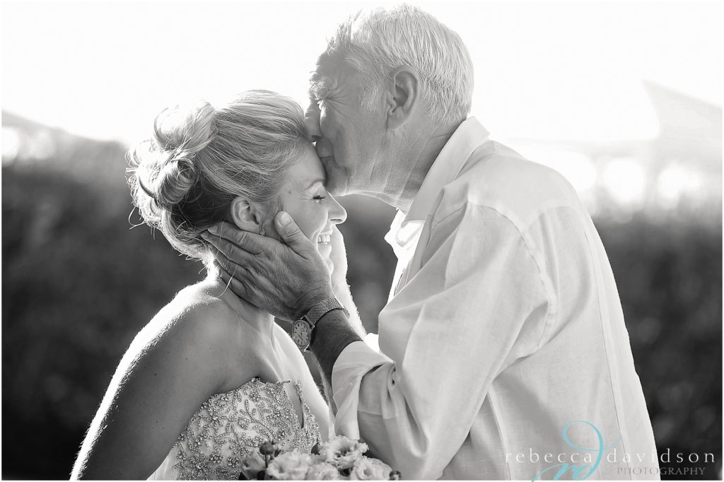 grandfather kisses bride