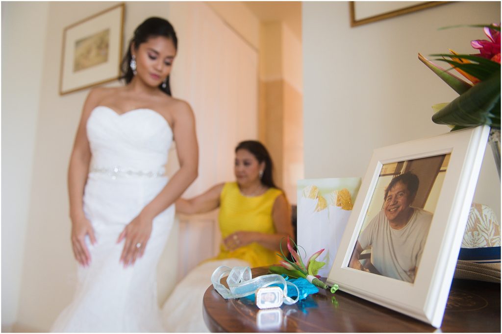 bride looking at picture of dad