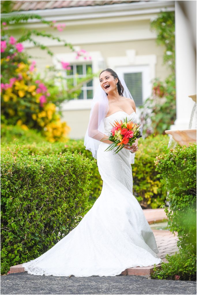 beautiful bride in garden laughing