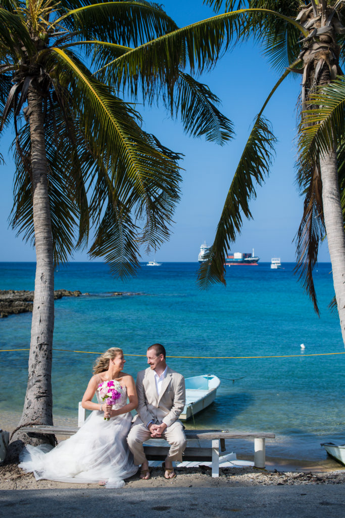 couple on boat under coconut tree
