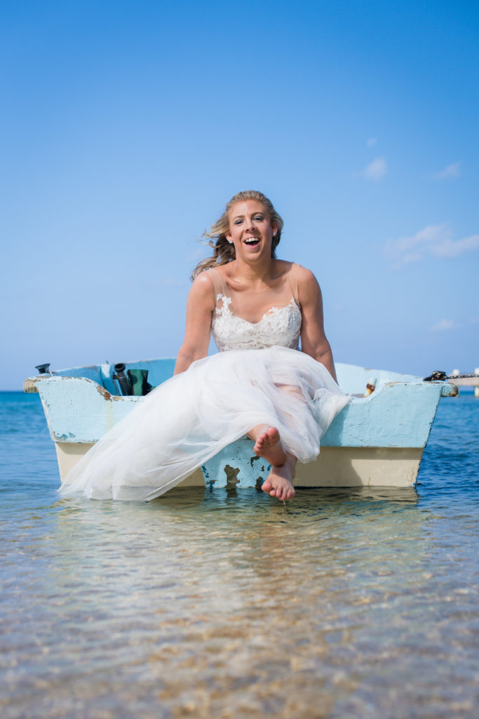 bride and groom on little boat