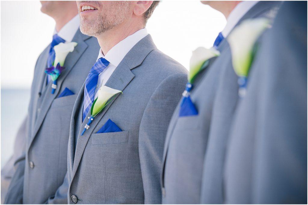 groomsmen in grey suits blue ties