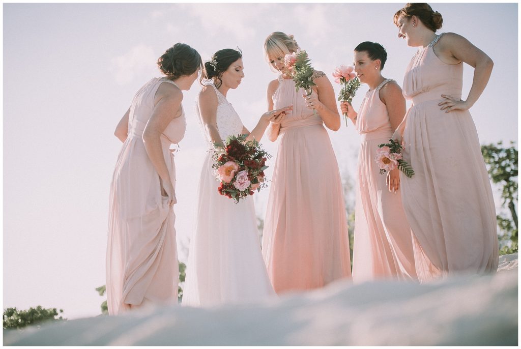 blush pink bridesmaids on beach