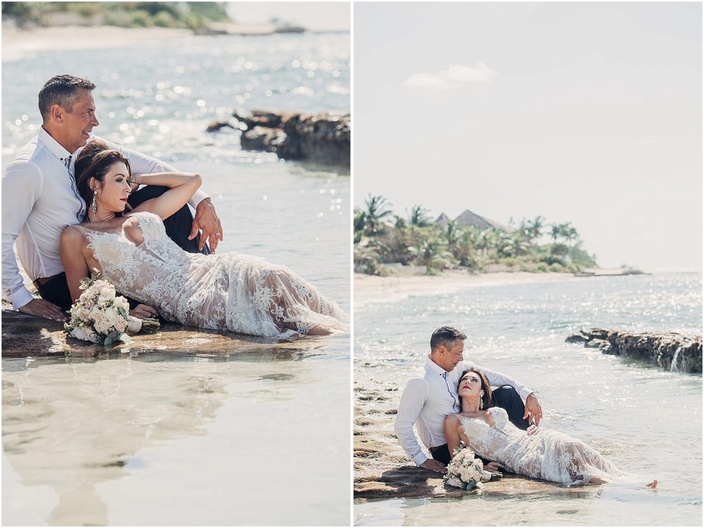 couple in water with wedding 