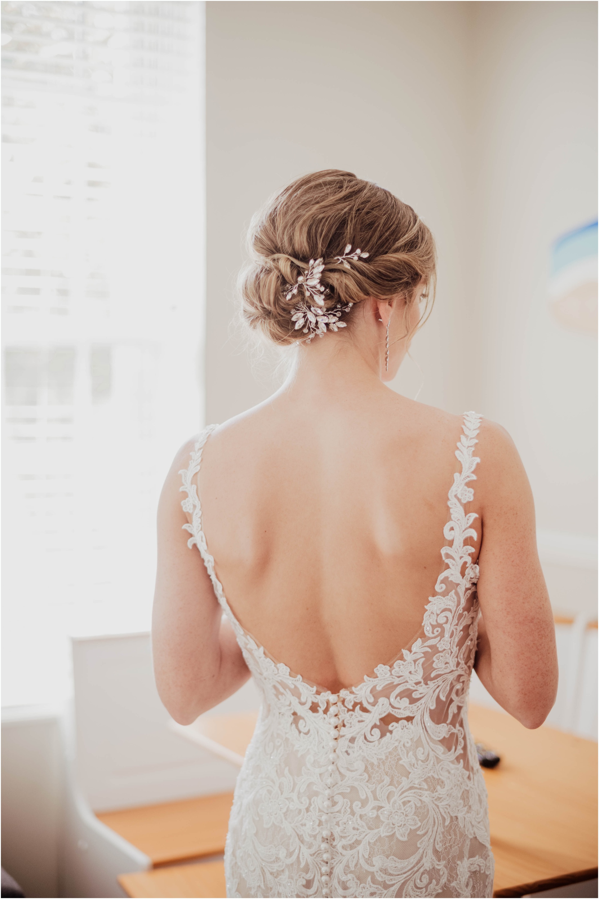 updo hair of bride back of gown essence of austria