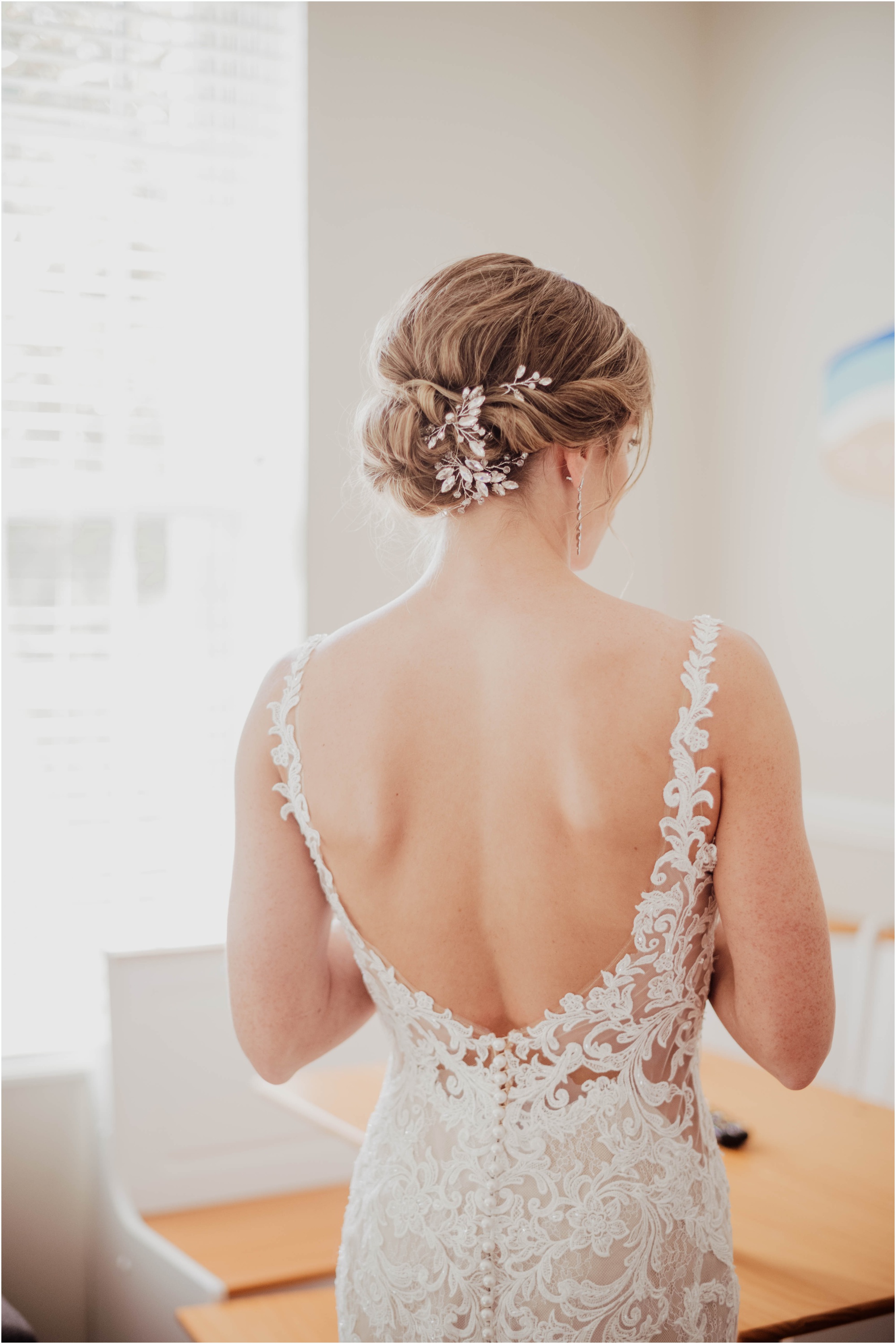 updo hair of bride back of gown essence of austria
