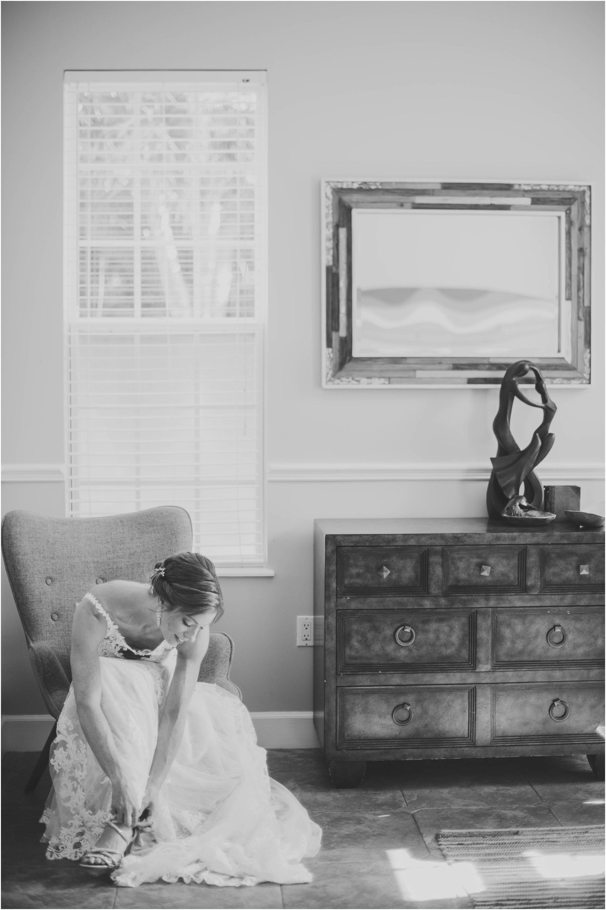 black and white bride in bedroom wearing Essence of Austria gown