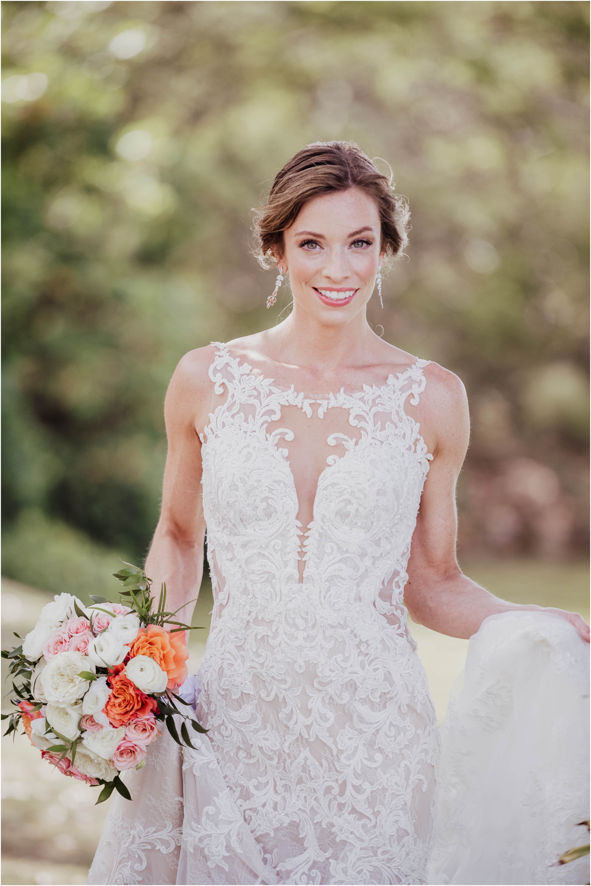 bride in garden wearing Essence of Austria gown