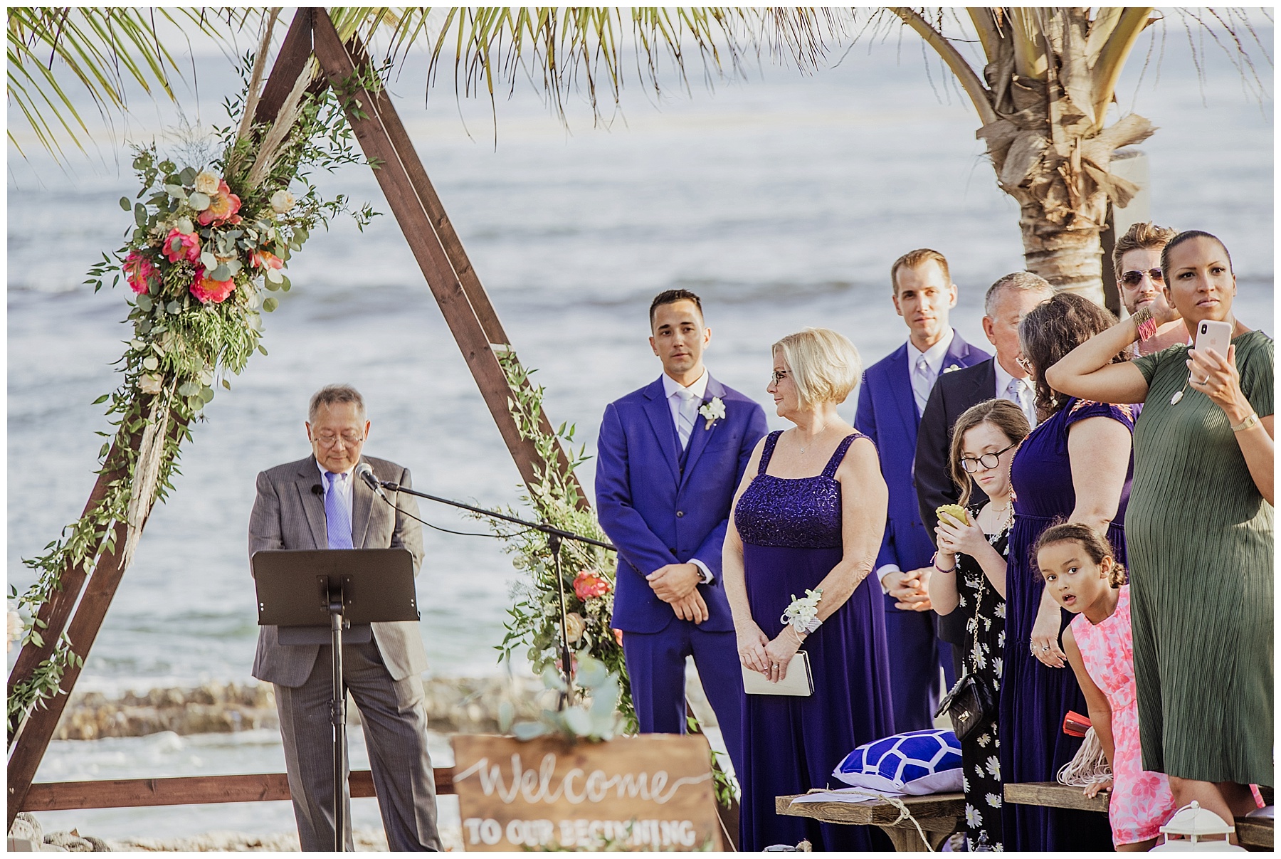 groom in navy blue suits waits for bride