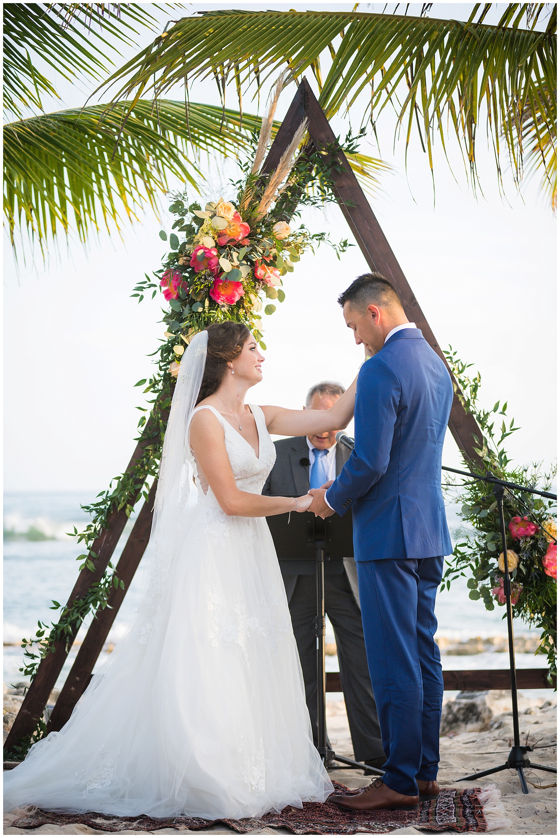 couple say i do triangle wooden arch