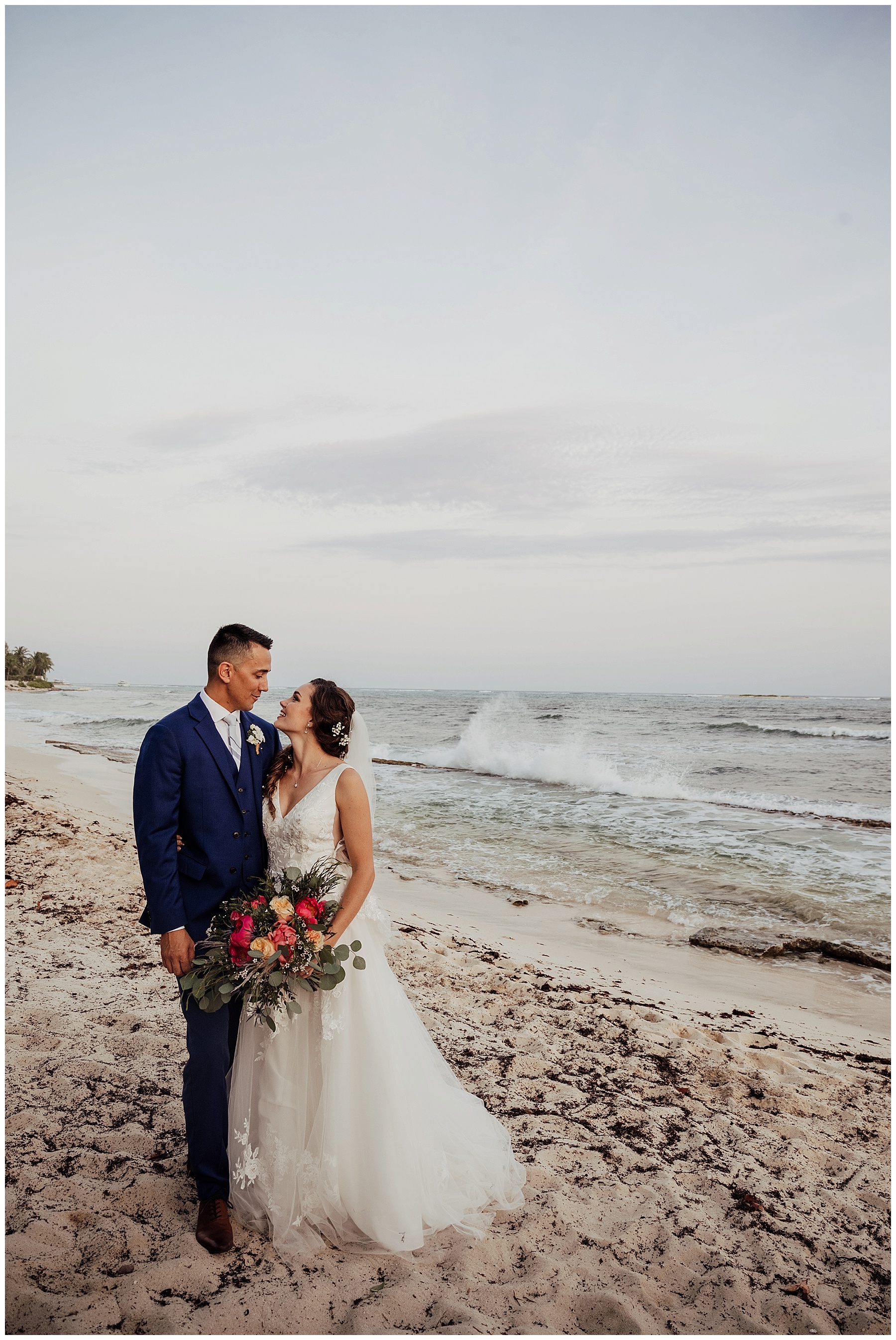 bride with boho bouquet on beach