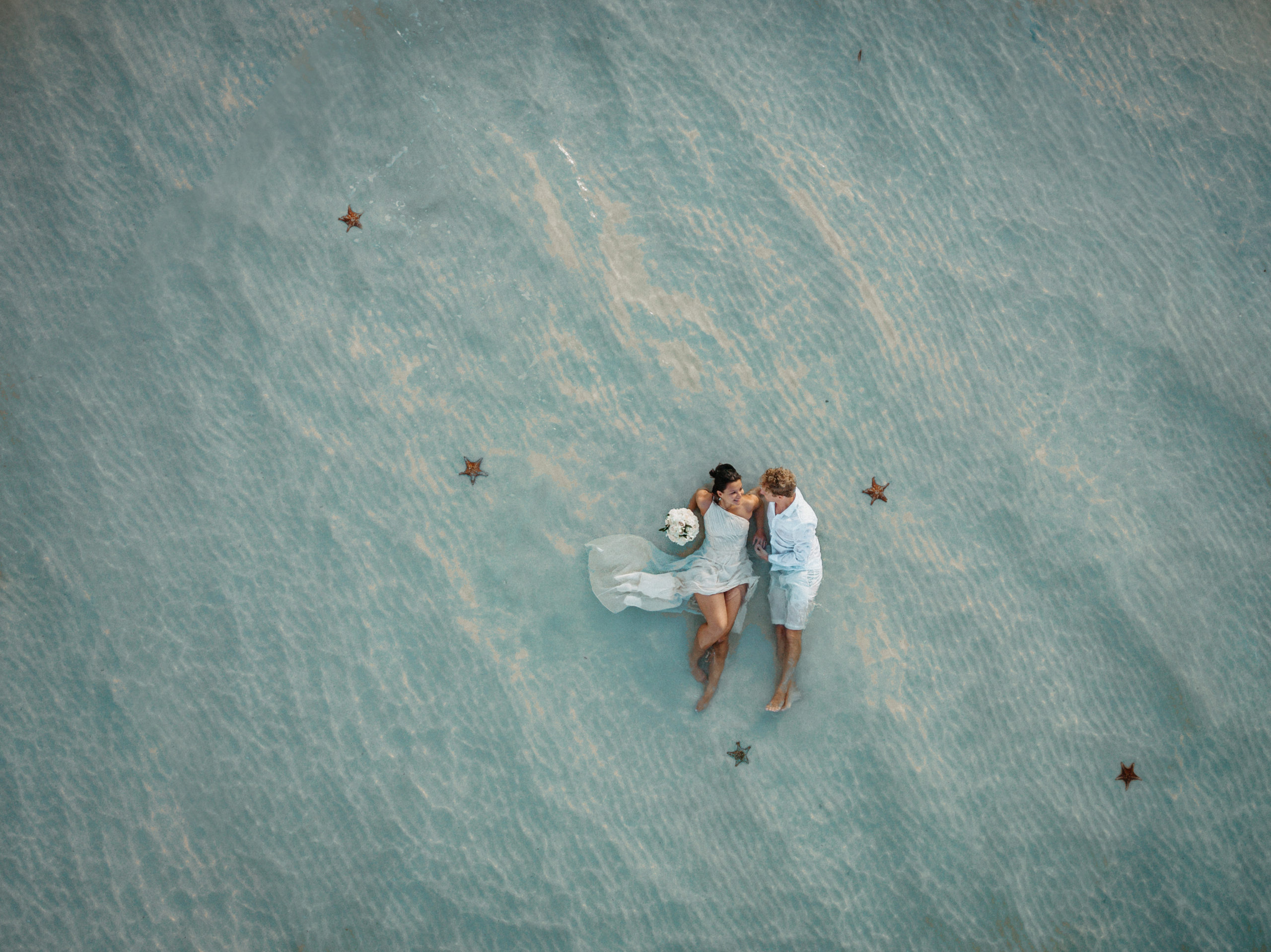 drone shot of bride and groom starfish point