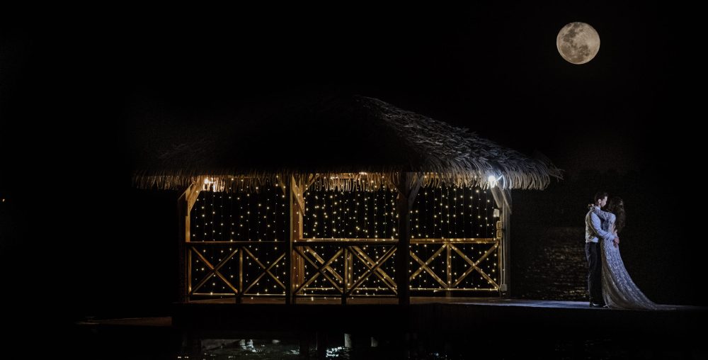 full moon with bride and groom at night